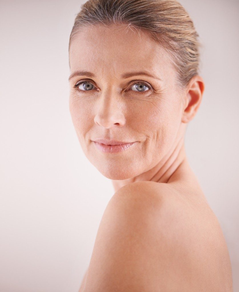 Woman with mild loose skin jawline non surgical skin tightening Lansing MI