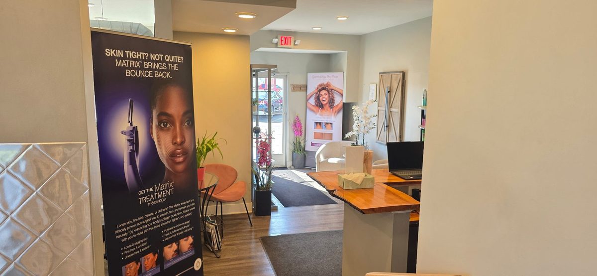 Lobby & Treatment Area – Maison Zolara Lansing Maison Zolara lobby interior with Candela Matrix and GentleMax Pro Plus treatment displays