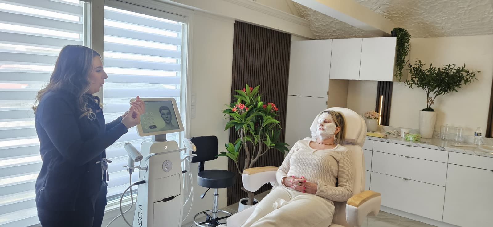 Clinician reviewing Candela treatment settings with a patient